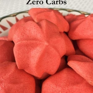 These Zero Carb Pink Puff Meringues are easy to make and a delight to eat. They pack a punch of sweet flavor and satisfying crunch. Amazingly, they have no carbohydrates and are only 3 calories each! #nocarbs #sugarfree #meringuecookies #lowcarbdessert #lowcarbrecipe #lowcarbcookies #lowcaloriedessert