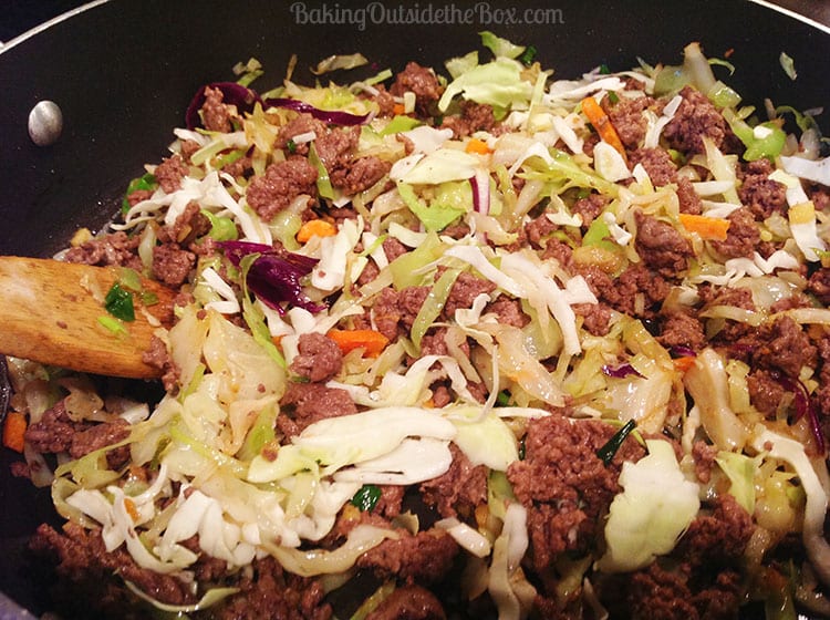 #bakingoutsidethebox | This Sriracha Slaw recipe is sometimes called 'Crack Slaw'. It's a delicious one-pan meal that is fast and satisfying for low carb lovers.